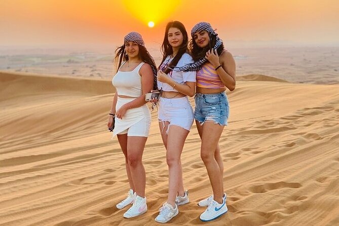 Private Evening Red Sand Desert Safari with BBQ Dinner - Camel riding, Arabian coffee, and henna