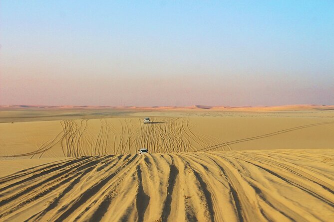 Qatar Gold Dune Safari, Dune Bashing,Camel Ride,Sand Boarding,Inland Sea Desert - Sandboarding: simple, sandy, and more tiring than it looks