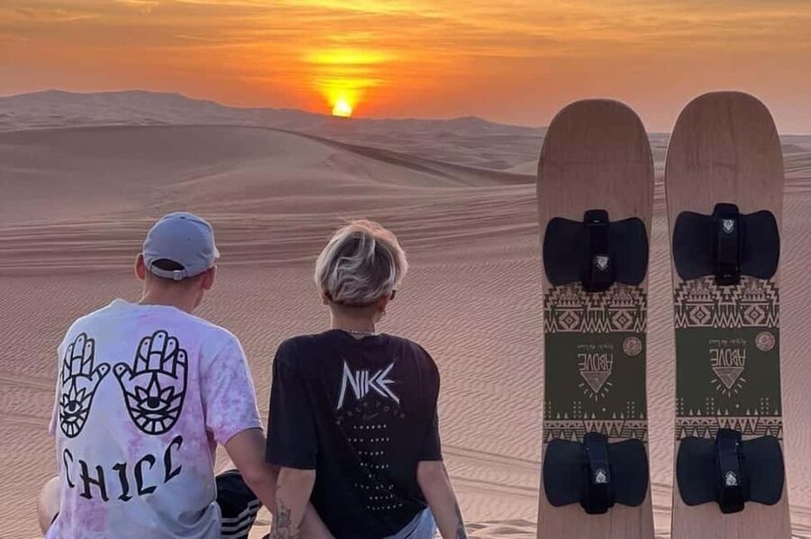 Qatar: Sunset Desert Safari with Camel Ride & Sandboarding - Dune bashing in a Land Cruiser