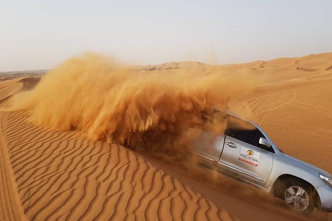 Red Dunes Desert Safari with BBQ Dinner - Belly dance, fire, and tannura after dark