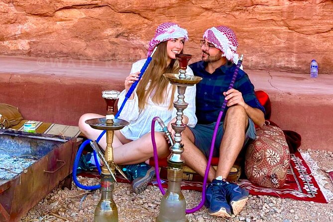Wadi Rum Full Day Jeep Tour + Overnight & Dinner in Bedouin Camp - Burdah Bridge from below, then sunset by the fire